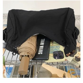 An elegant black shoulder bag for travel and work